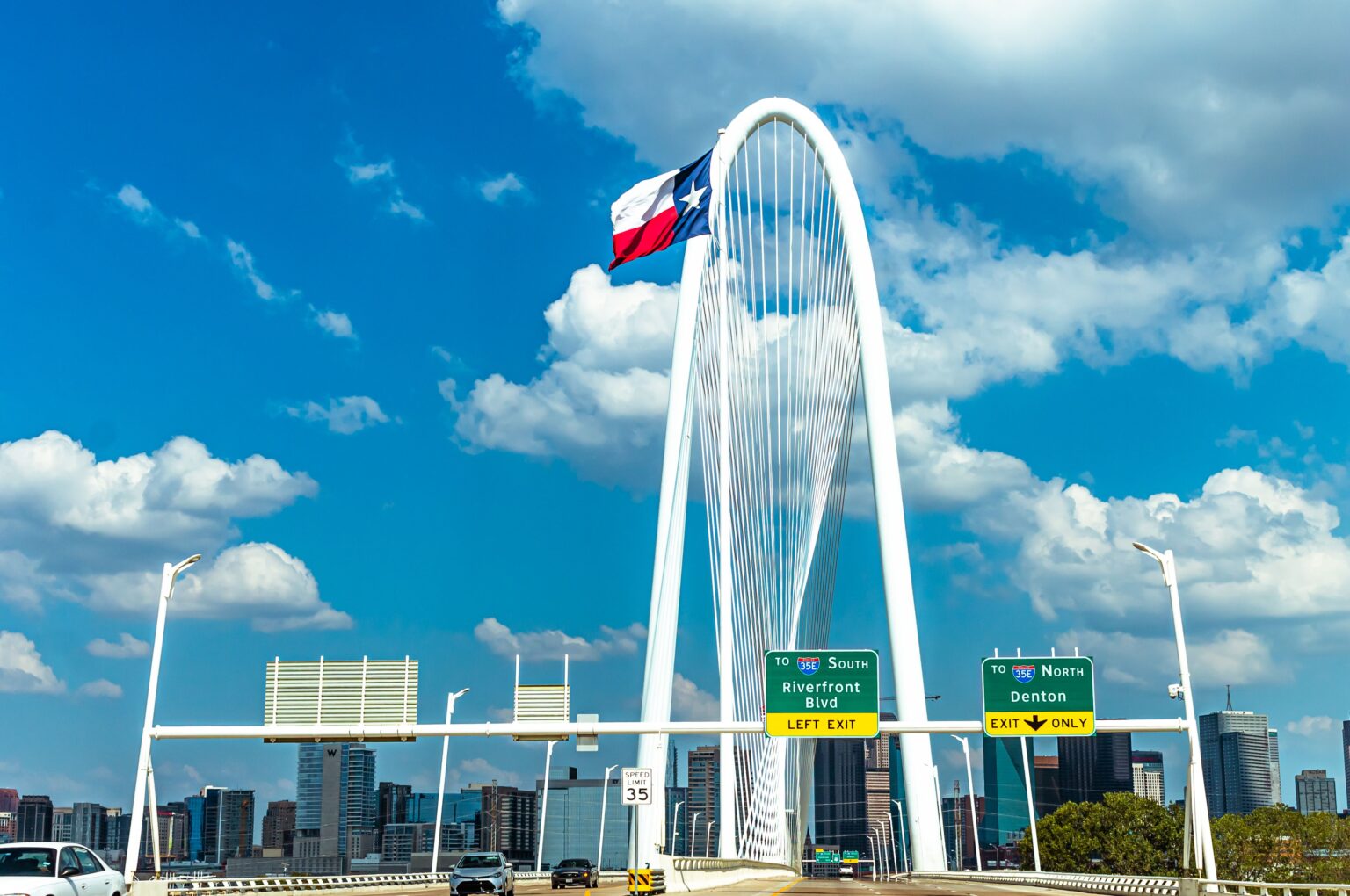 Dallas commercial video production — Margaret Hunt Hill Bridge with the Texas flag, a signature Dallas commercial location