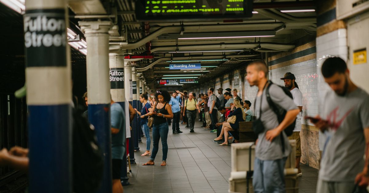 People at a train station platform, illustrating Seattle transit video production